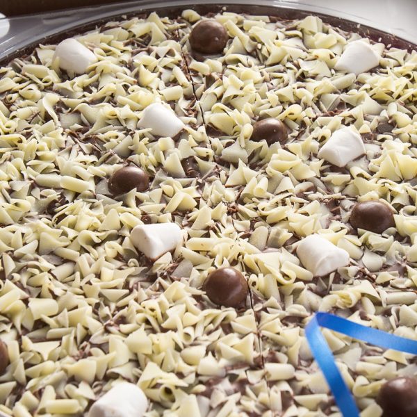 Honeycomb and marshmallow chocolate pizza close up.