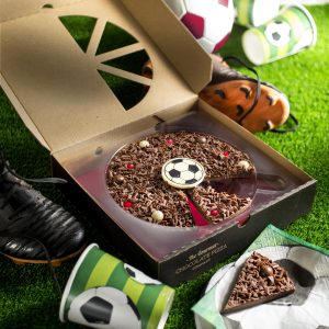 Football chocolate pizza in open box