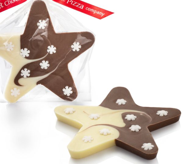 Milk and white chocolate star with snowflake decoration close up